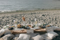 Beautiful white themed beach picnic setup.