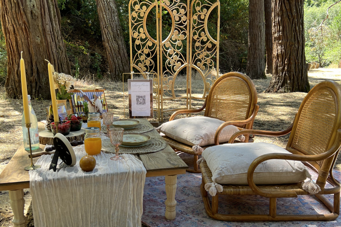Luxury picnic in the woods featuring golden decorations.