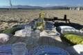 Tablescape for a luxury picnic with yellow flowers