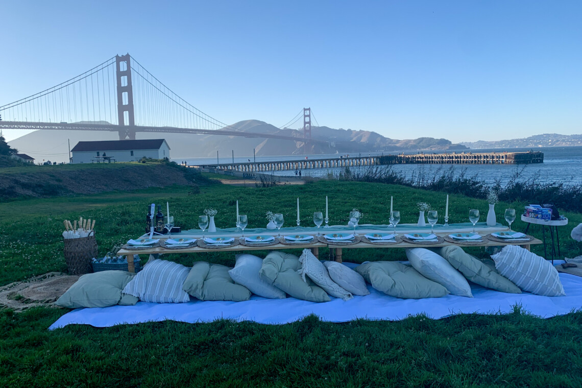 10 person picnic in the Bay Area, highlighting the Golden Gate Bridge.