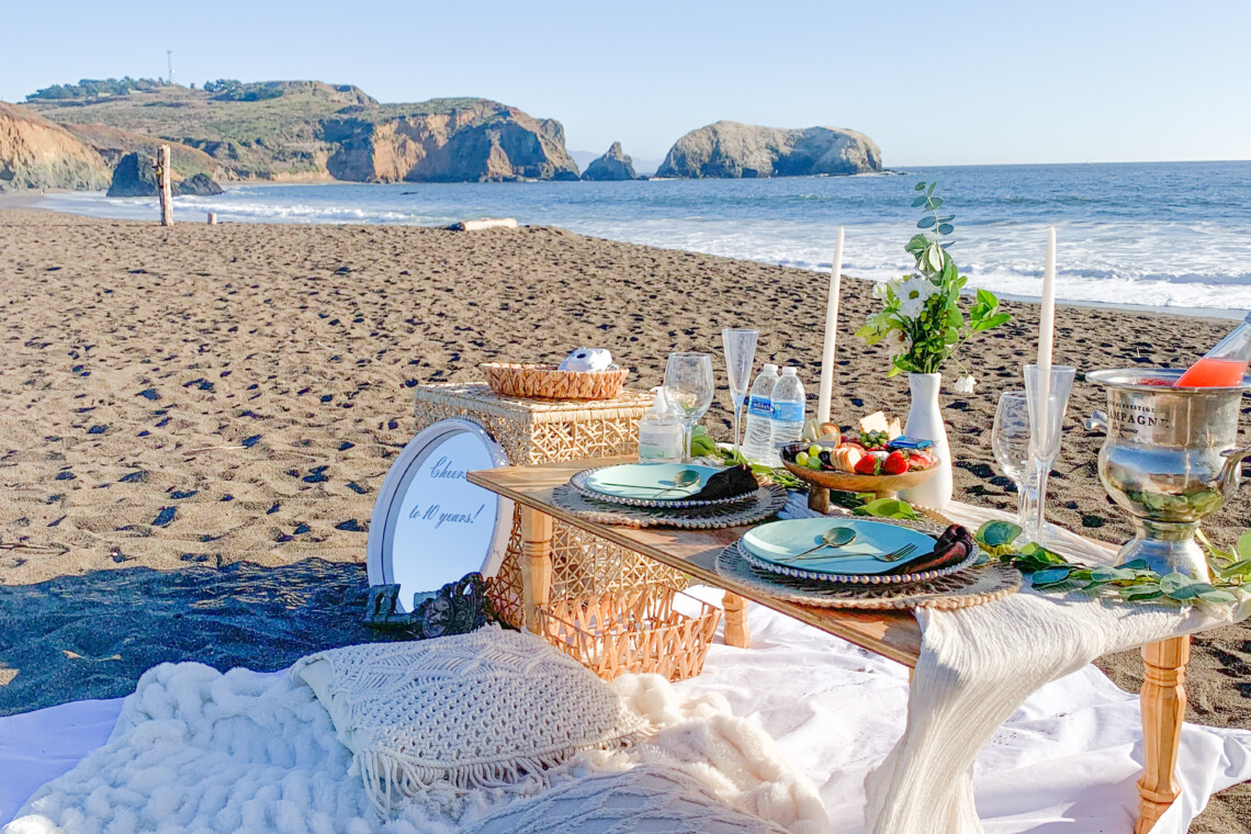 Luxury beach picnic at Baker's Beach with San Francisco Bay in the background.