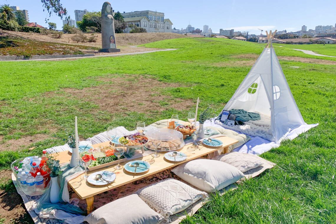Luxury picnic with teepee, sandwich platter, and charcuterie bowl at Fort Mason, San Francisco, Ca.