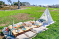 Luxury picnic with teepee, sandwich platter, and charcuterie bowl at Fort Mason, San Francisco, Ca.