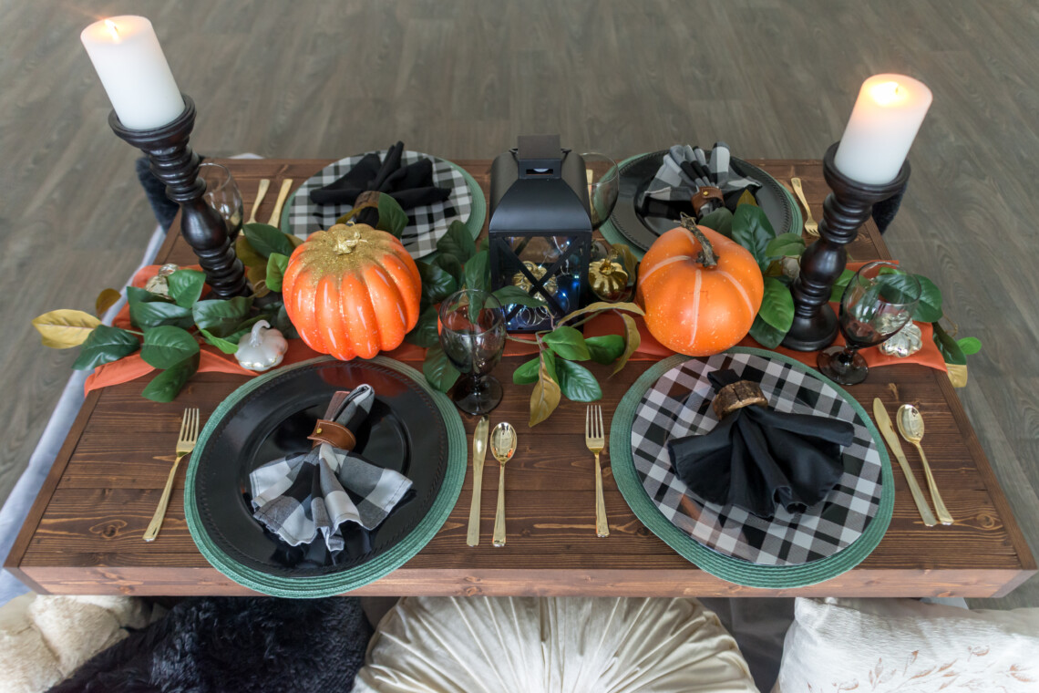 Halloween themed luxury picnic with pumpkins and black and white color scheme.