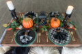 Halloween themed luxury picnic with pumpkins and black and white color scheme.