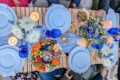 Blue themed luxury picnic in Miami festooned with blue cups and flowers.