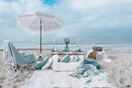 Boho blue luxury picnic at the beach in Los Angeles