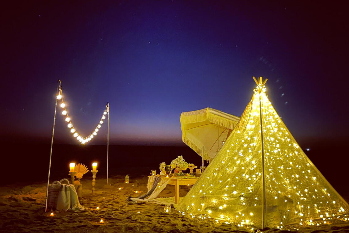Luxury picnic at the beach in Los Angeles with fairy lights